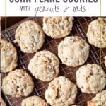 corn flake cookies lined up on a wire cooling rack.