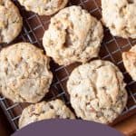 corn flake cookies lined up on a wire cooling rack.