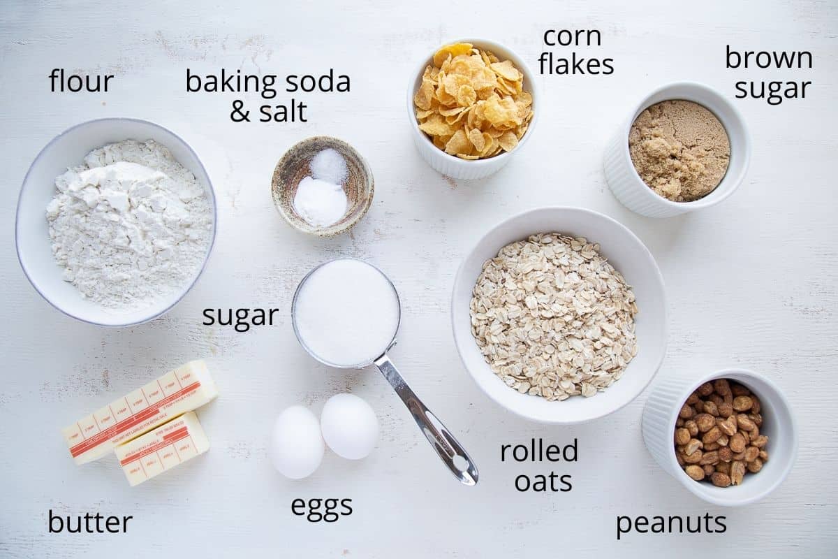 ingredients for corn flake cookies on a white table.