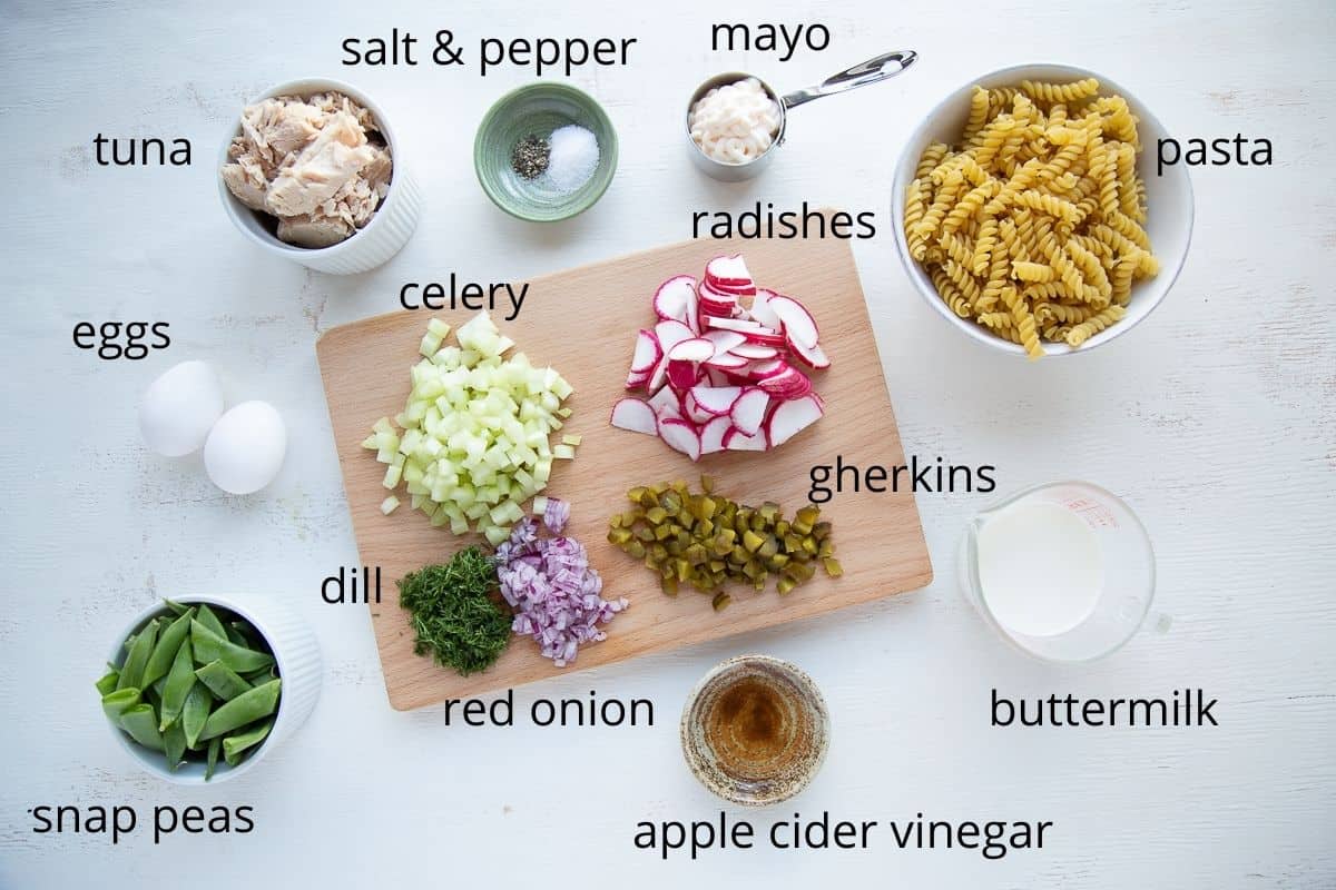 ingredients for tuna pasta salad on a white table.