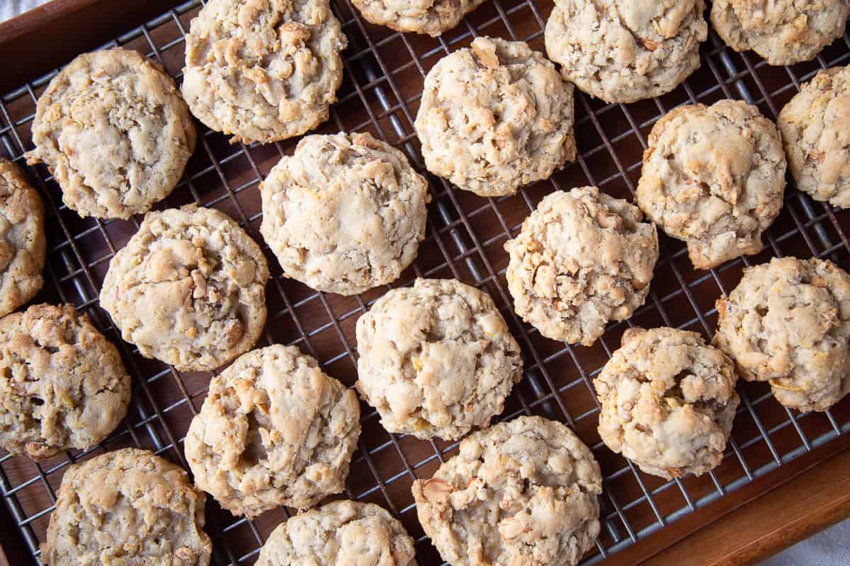 corn flake cookies lined up on a wire cooling rack.