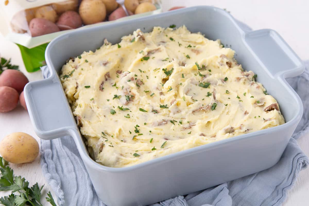 mashed potato casserole in a blue square dish.