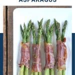 prosciutto wrapped asparagus on a white platter.