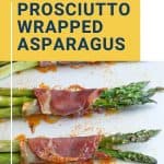 prosciutto wrapped asparagus on a white platter.