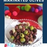 marinated olives in a decorative glass dish.