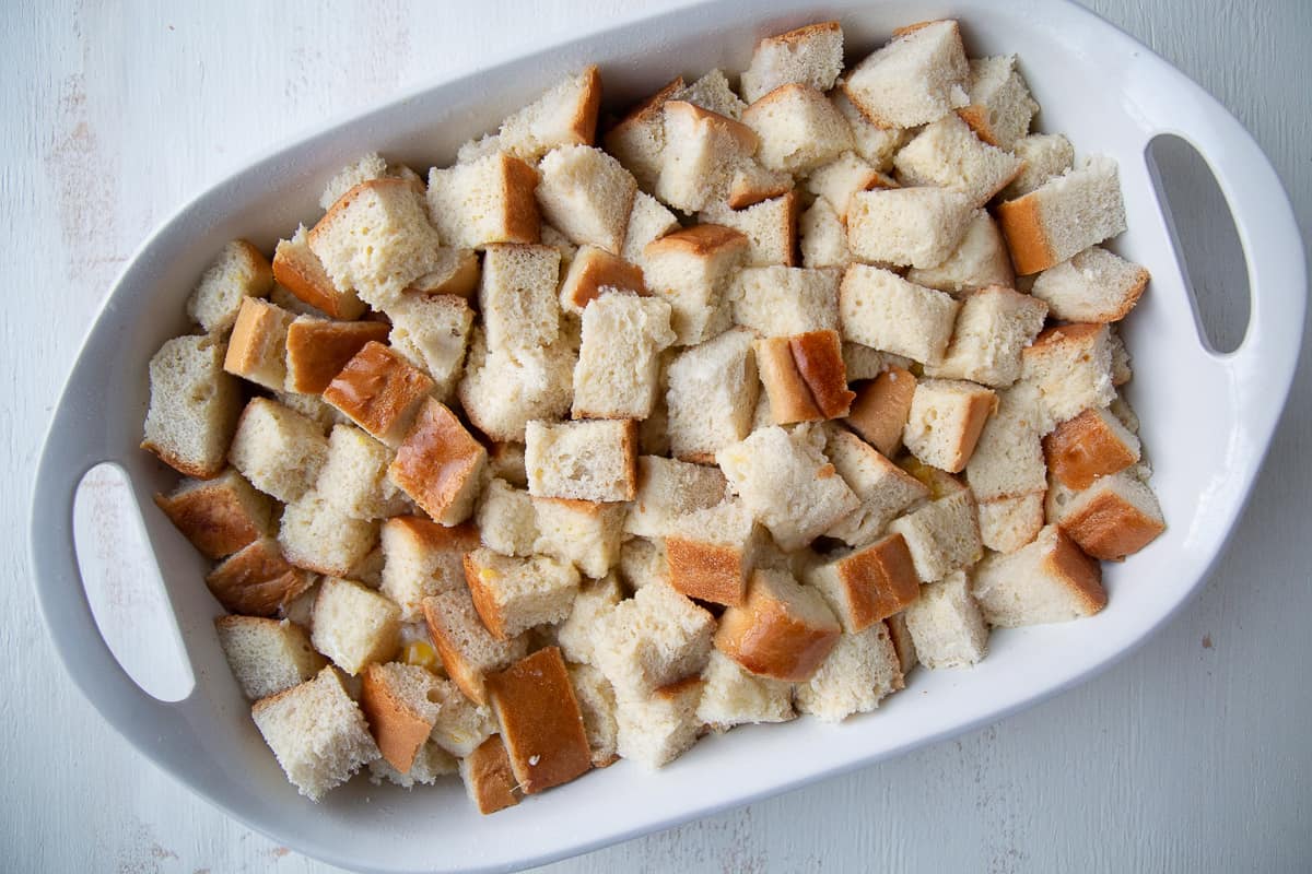 uncooked french toast casserole in a white dish.