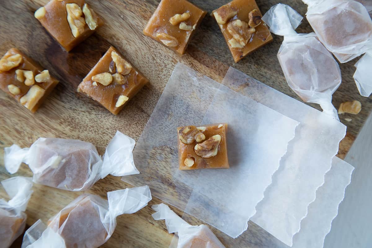 caramels wrapped in pieces of wax paper.