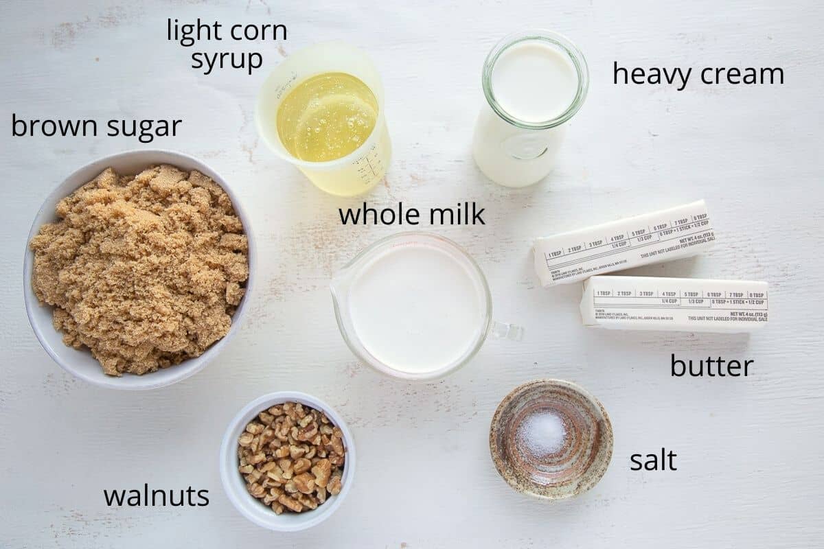 ingredients for walnut caramels on a white table.