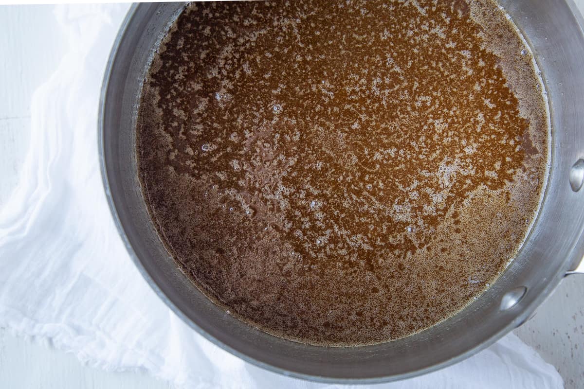 butter and sugar mixture in a metal pan. 