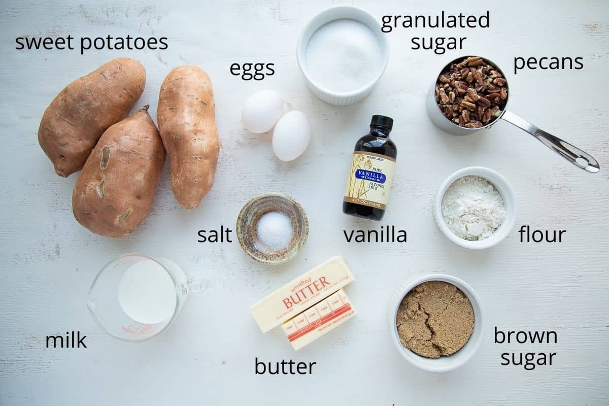 sweet potato casserole ingredients on a white table.
