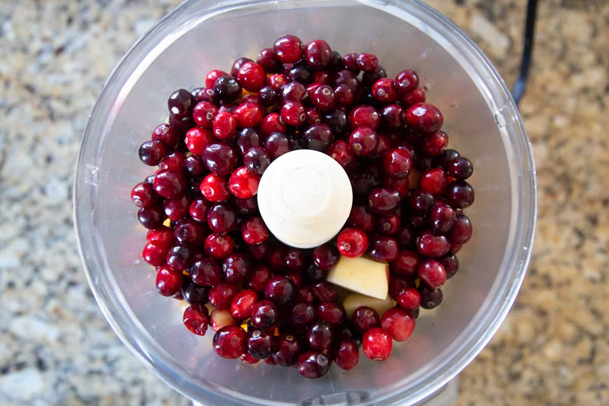 fresh cranberries in a food processor.