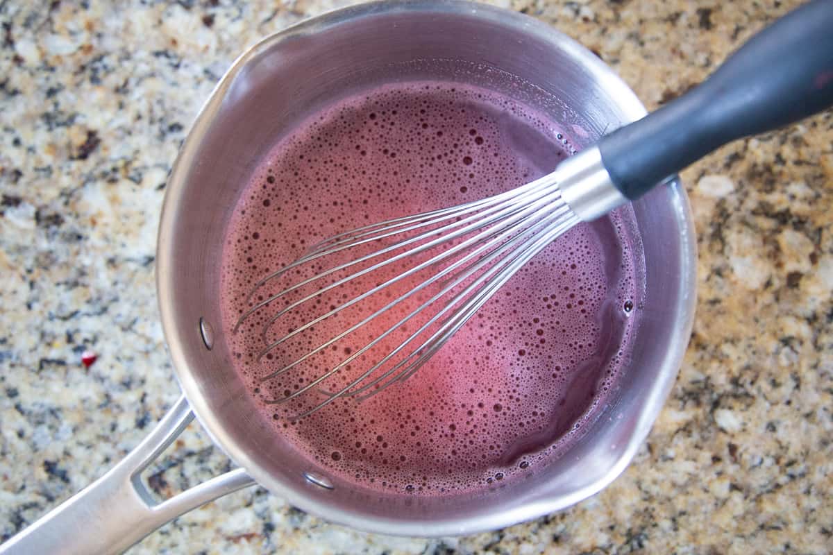 whisk in a saucepan with strawberry jello.