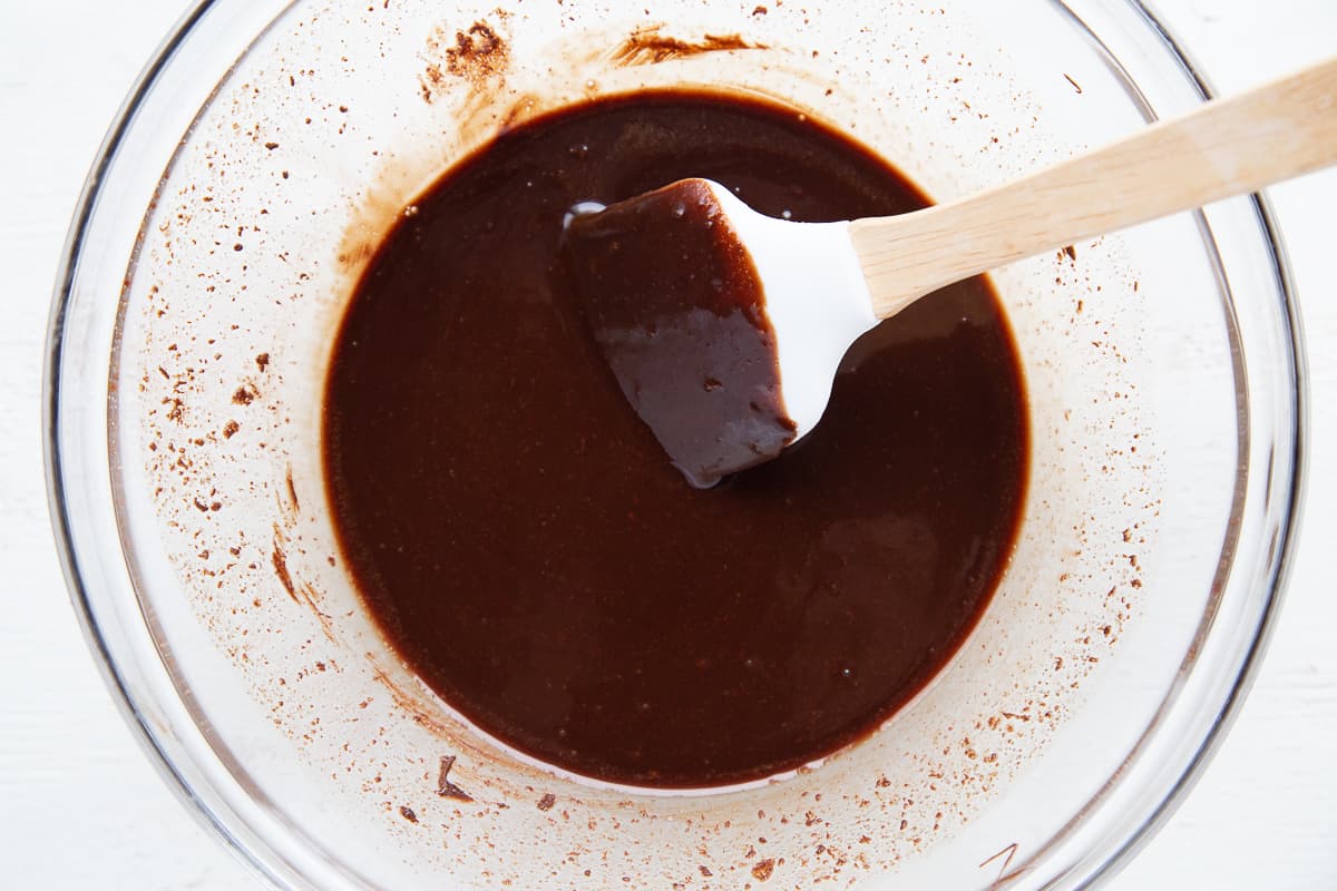 chocolate mixture with a spatula in a glass bowl.