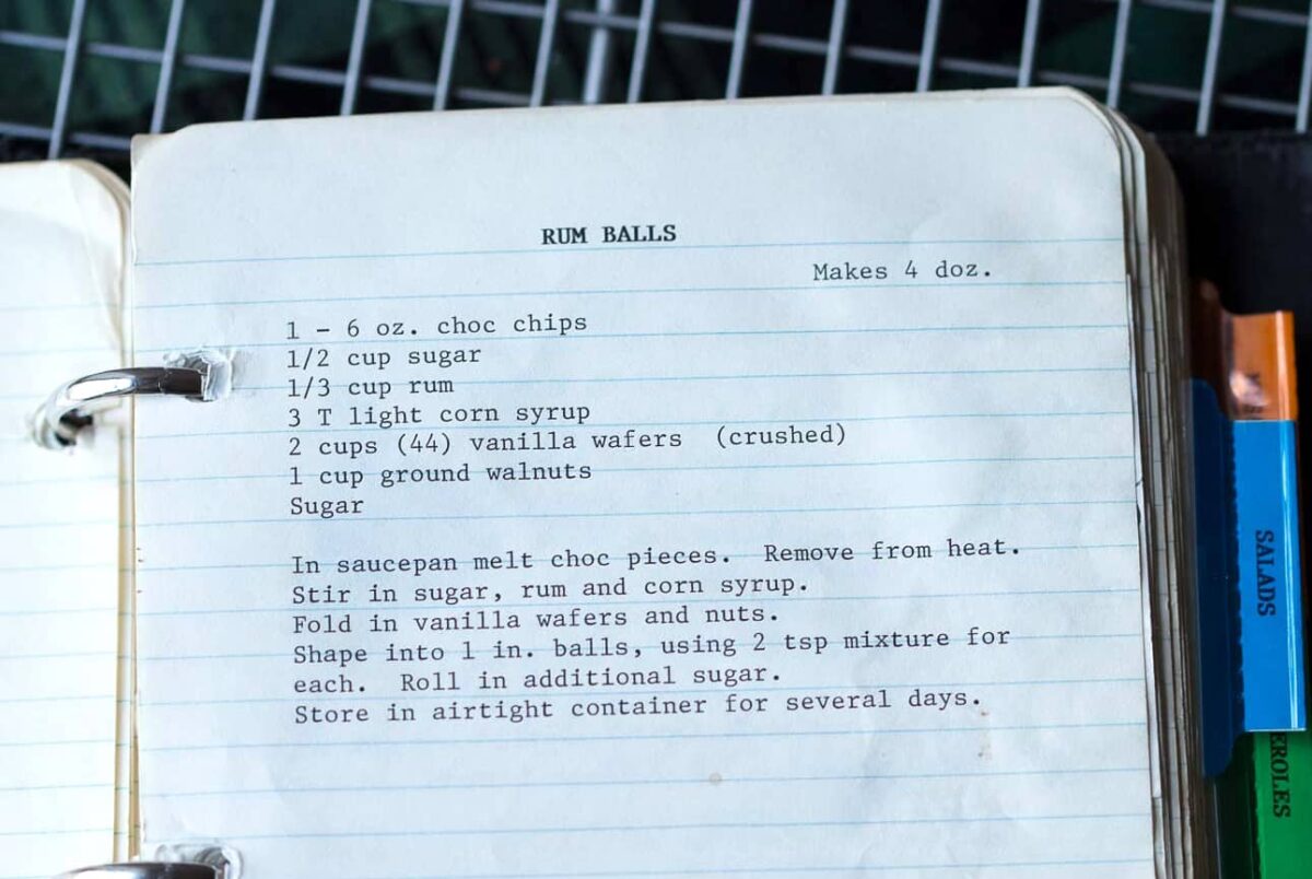 typewritten recipe for rum balls on lined notebook paper.