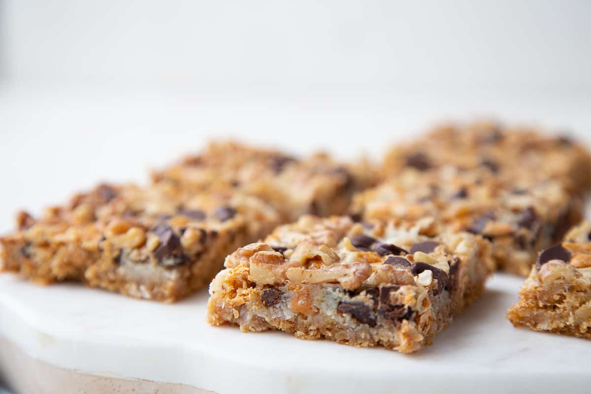 side view of 7 layer bars sitting on a white marble board.