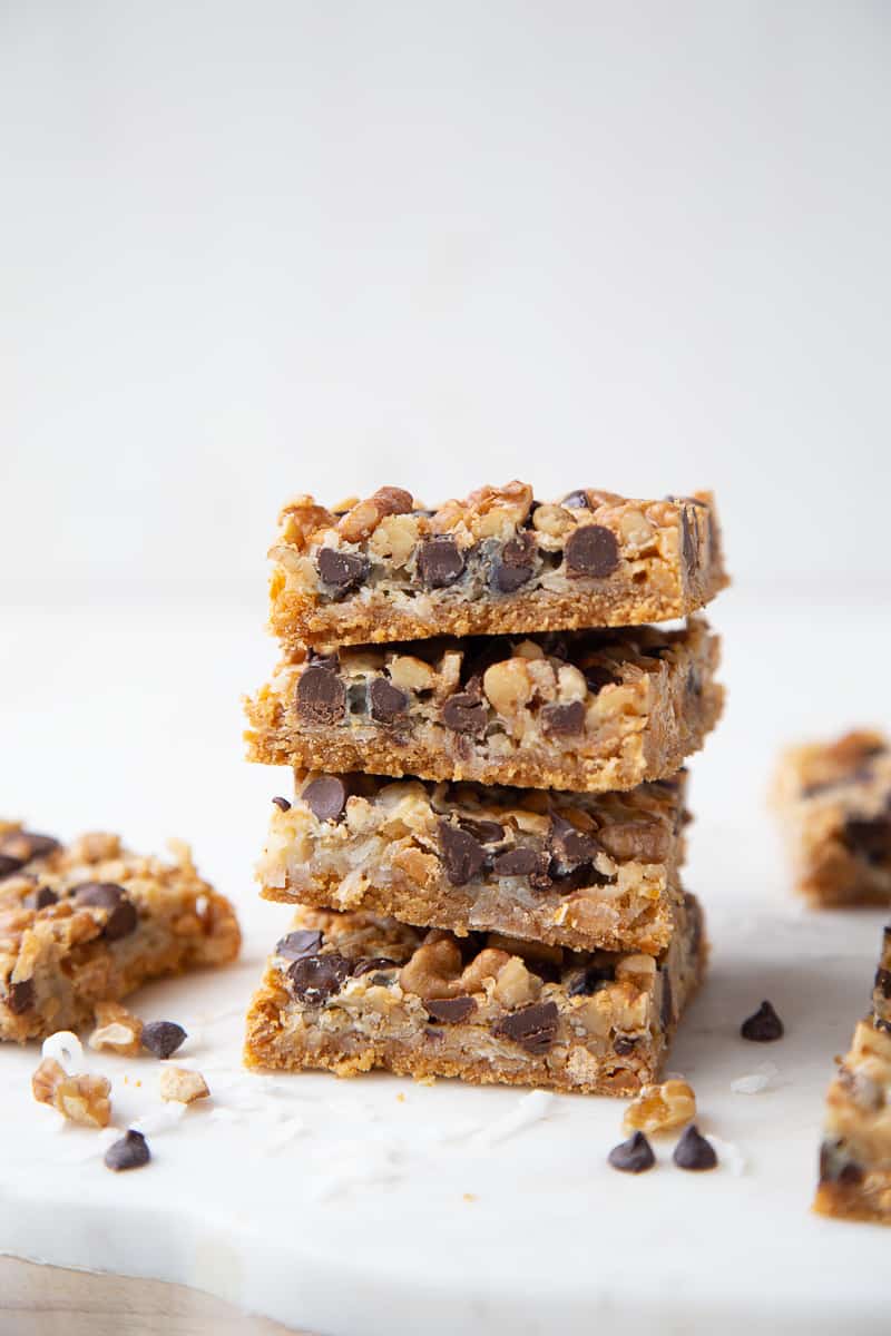 7 layer bars stacked on top of one another on a white marble board.