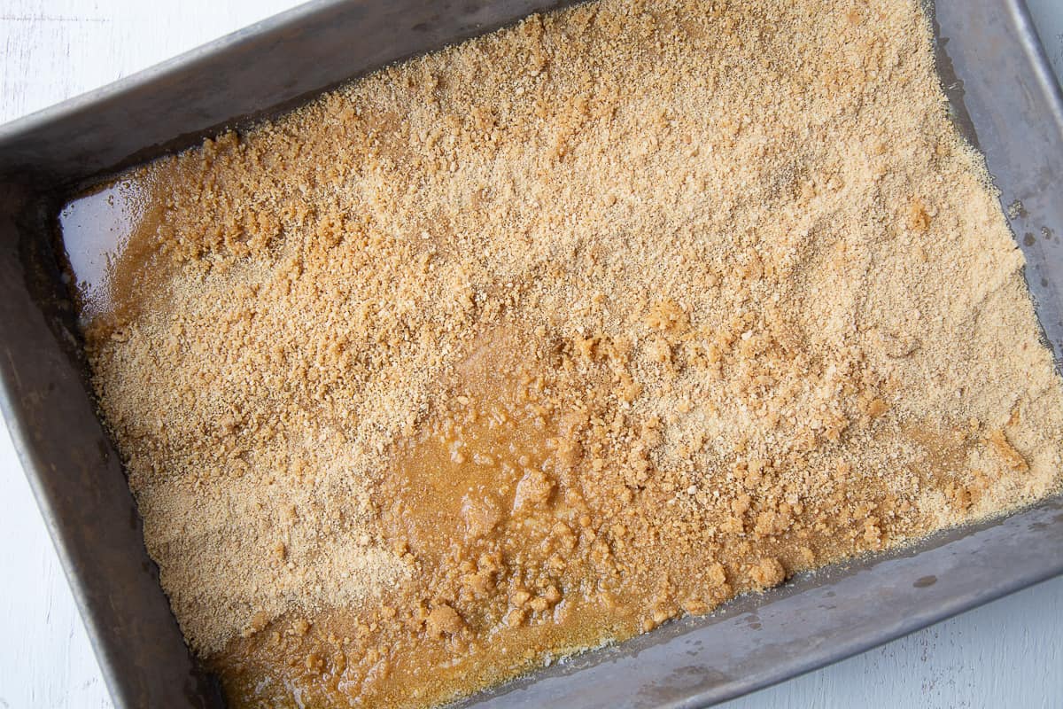 graham cracker crumbs and butter in a 13x9 inch metal pan.