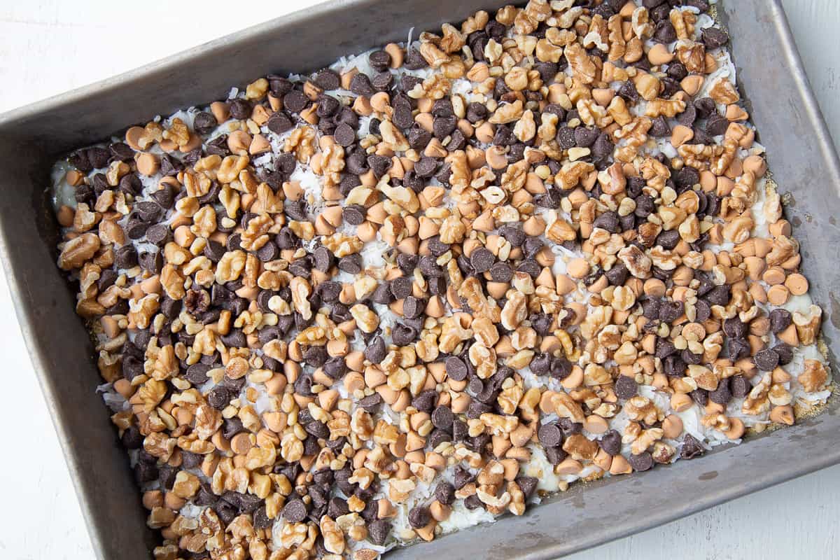 unbaked 7 layer bars in a metal pan. 