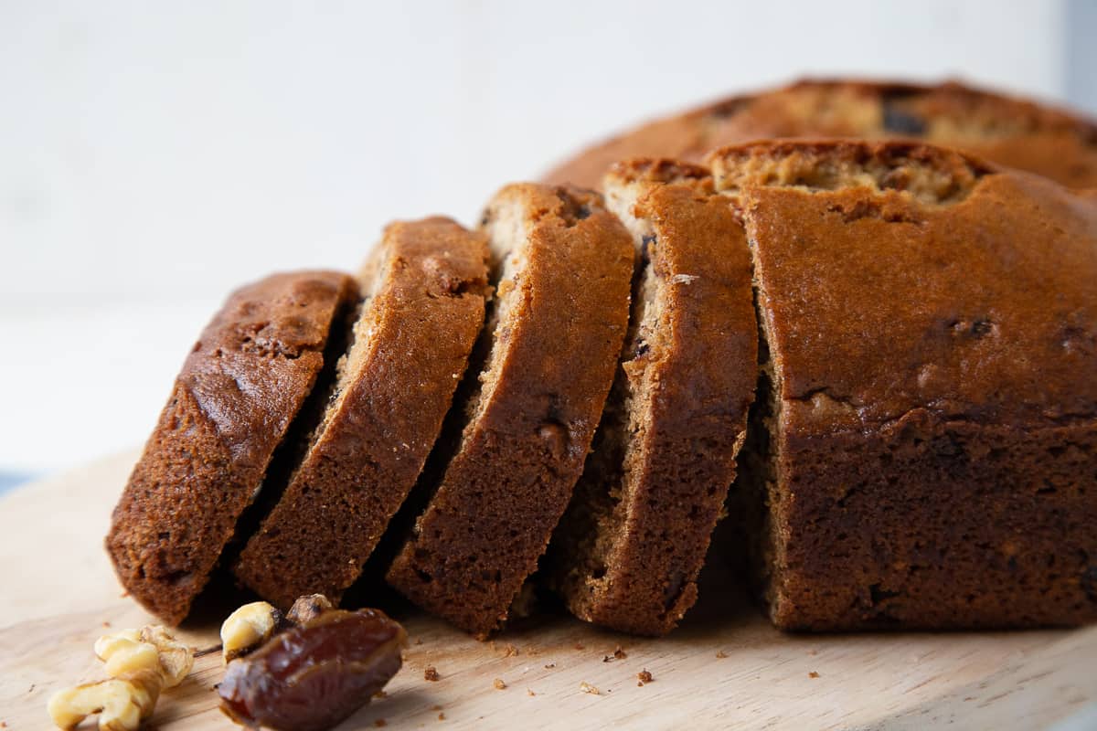 slices of date nut bread leaning onto each other.