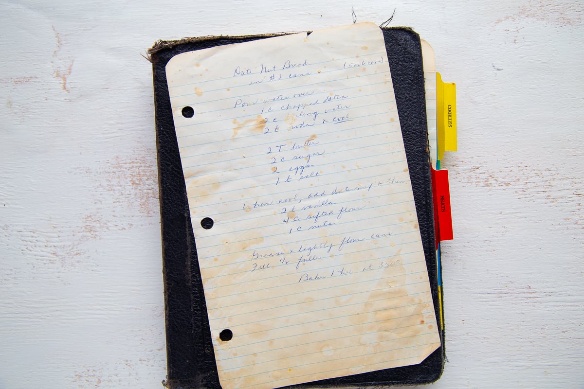 recipe for date nut bread hand printed on white notebook paper.