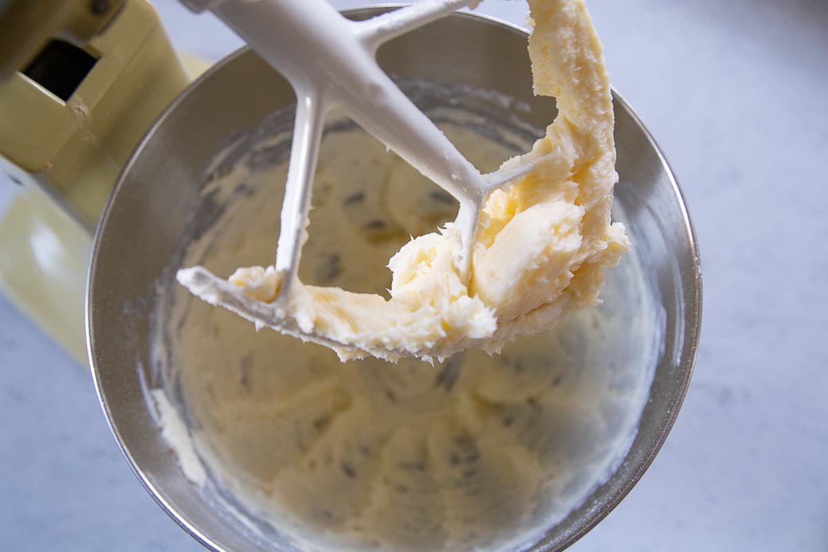 stand mixer with a paddle attachment with butter and sugar.