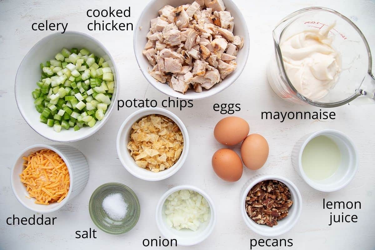 ingredients for hot chicken salad on a white table.