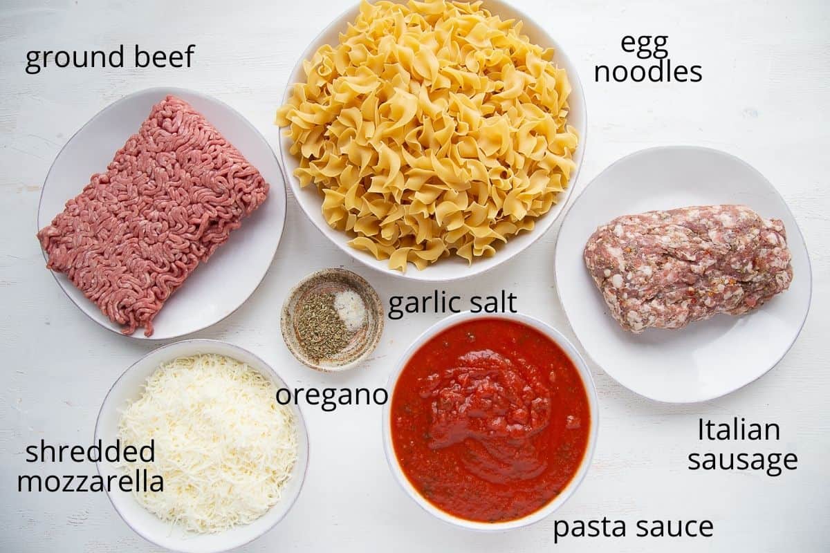 ingredients for pizza casserole on a white table.