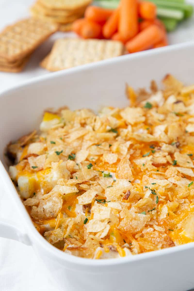 hot chicken salad in a white casserole dish.