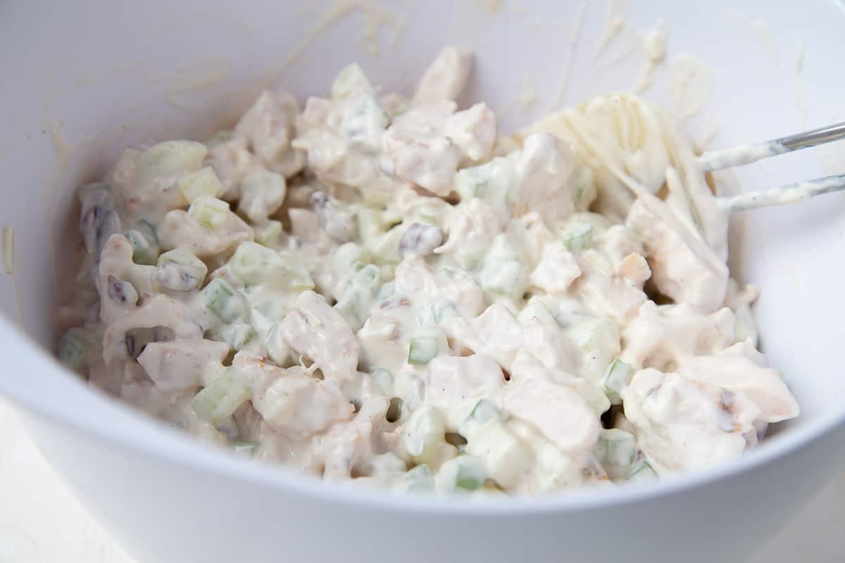 chicken salad in a large white bowl.