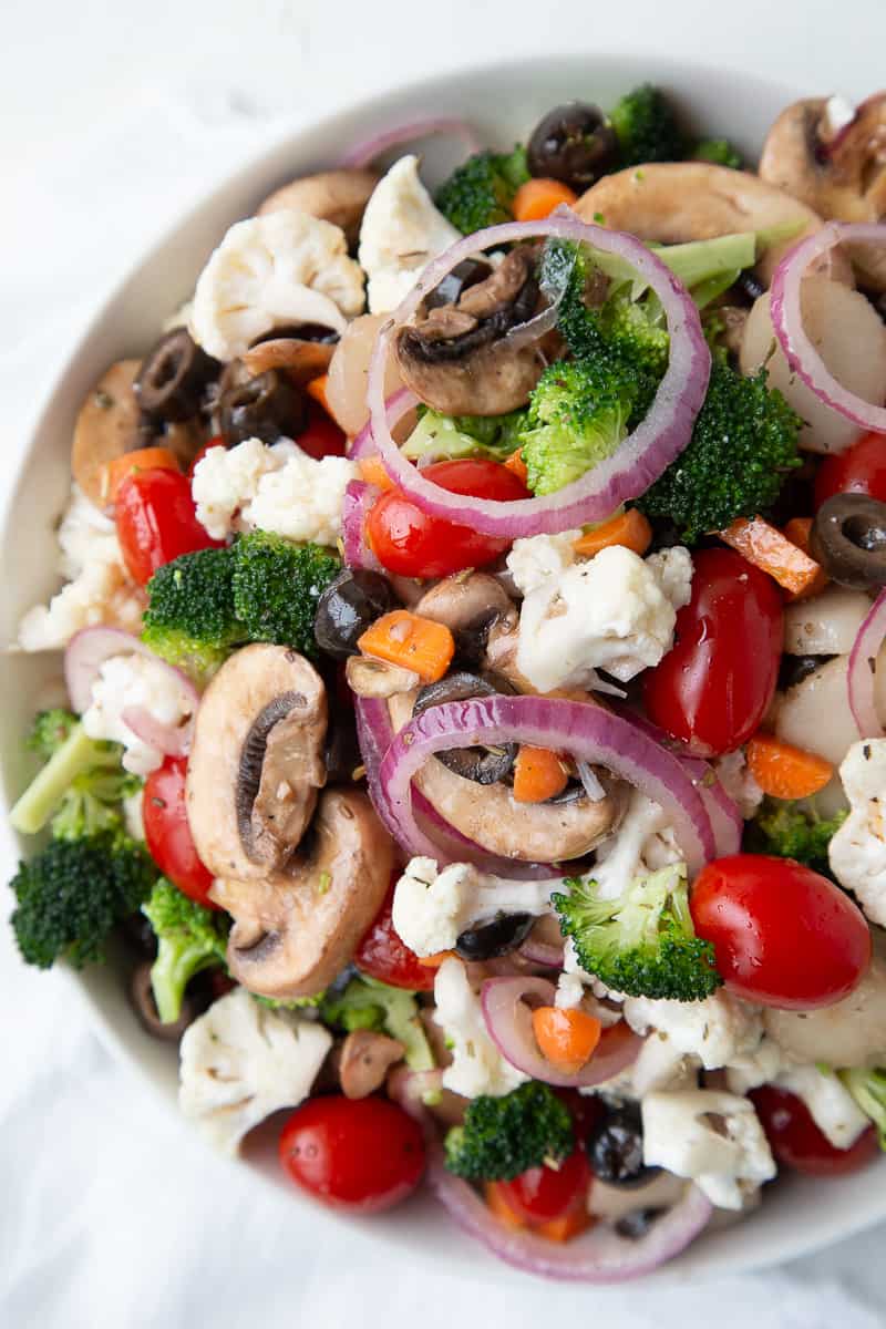 marinated vegetable salad in a white bowl.