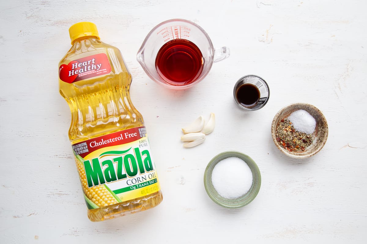 vinaigrette ingredients on a white table.