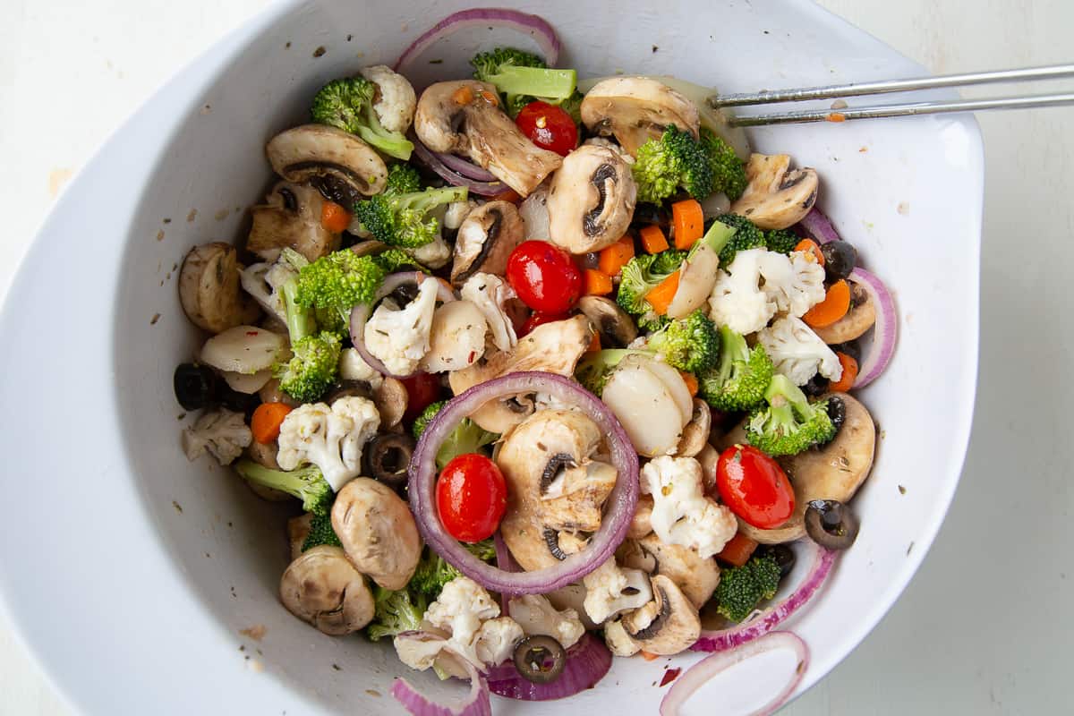 vegetable salad in a white mixing bowl.