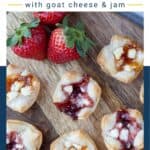 Puff Pastry Bites with Goat Cheese and Jam on a wooden serving platter.