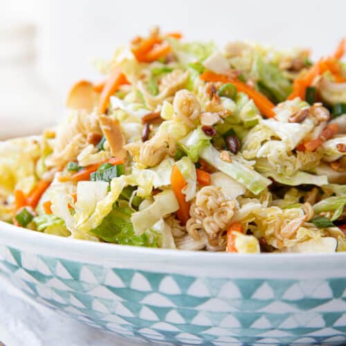 asian cabbage salad in a blue and white decorative bowl.