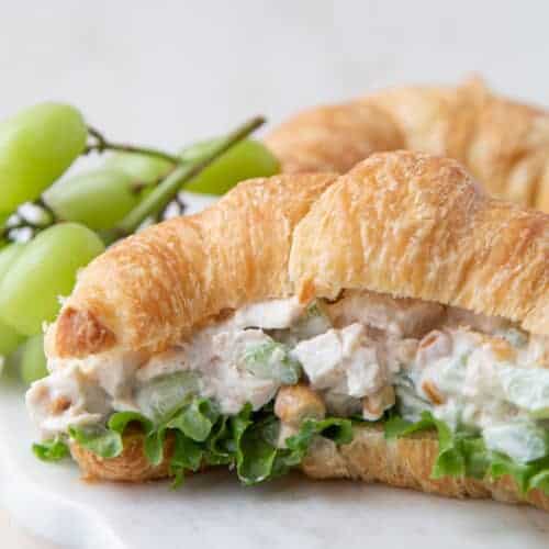 chicken salad with grapes on a croissant.