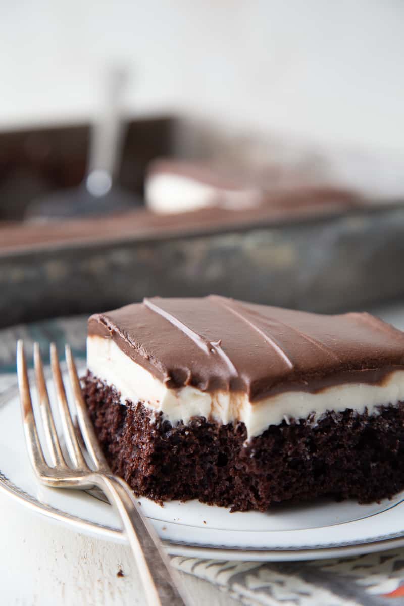 ding dong cake slice on a plate with a bite taken out and a fork next to it.