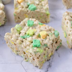 lucky charms treats sitting on a white marble table.