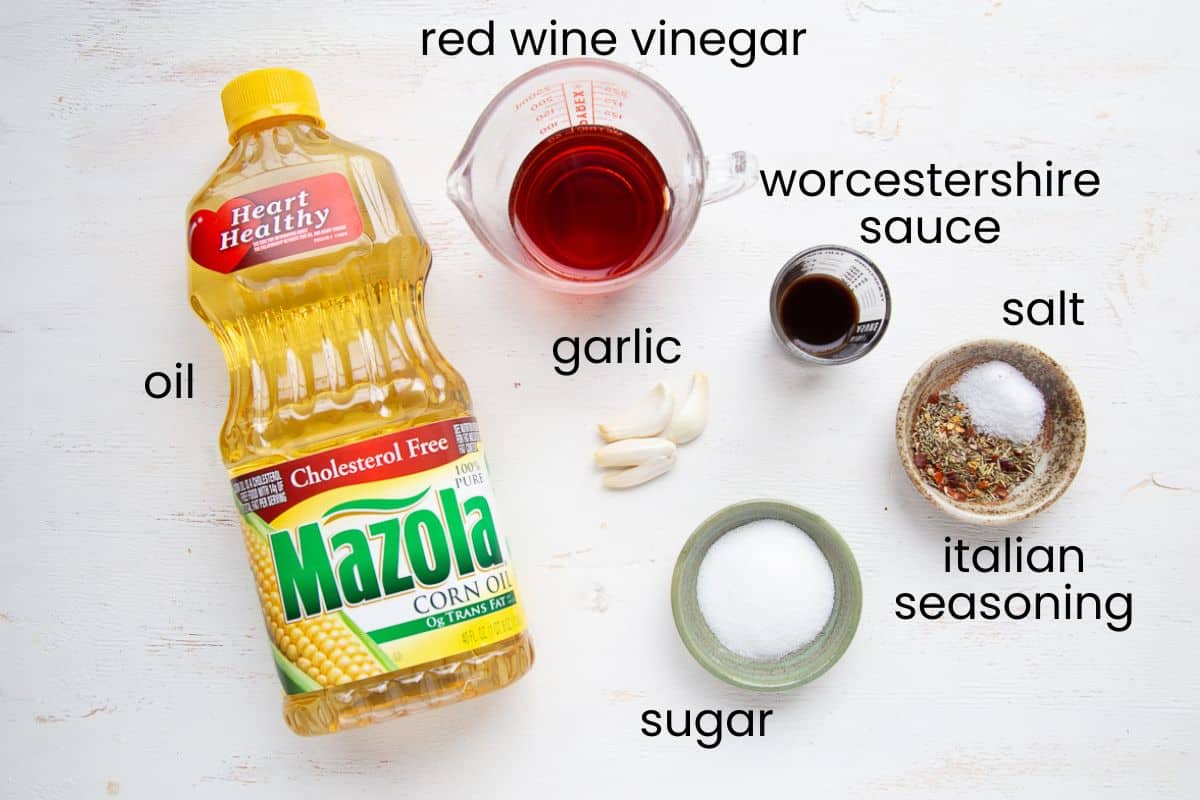 oil, vinegar, salt, and other ingredients in small bowls.