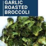 garlic roasted broccoli on a white platter.