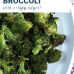 garlic roasted broccoli on a white platter.