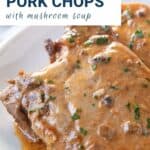 crock pot pork chops on a white oval platter.