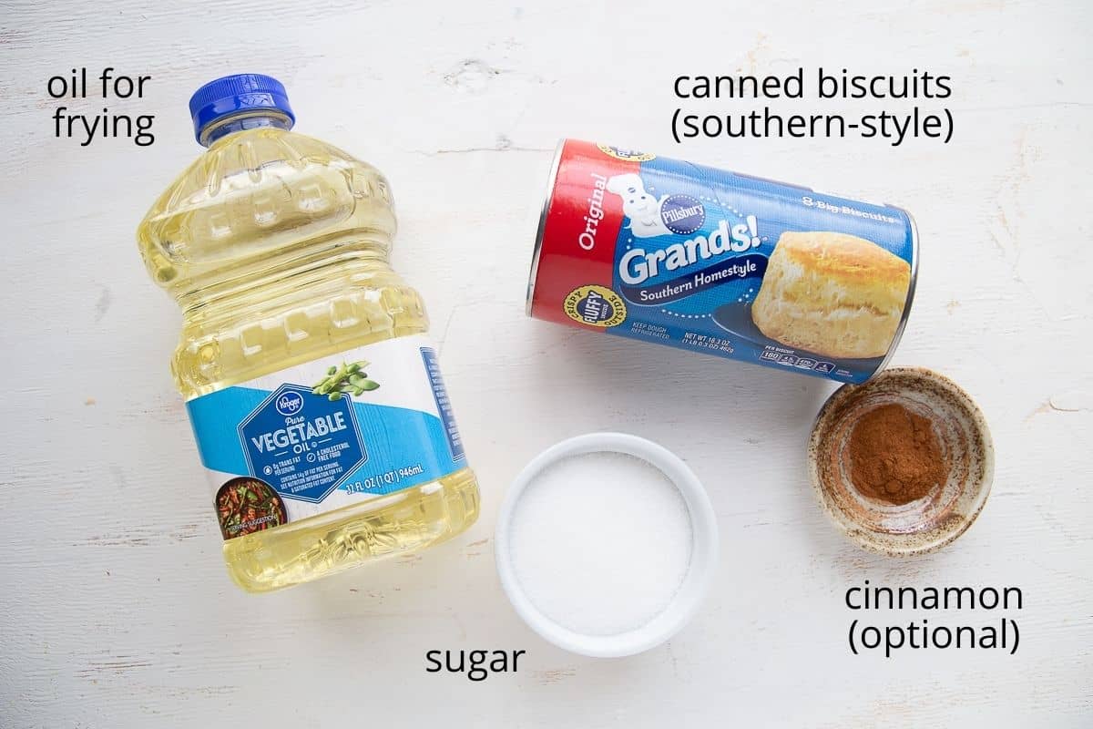 ingredients for biscuit donuts on a white table.