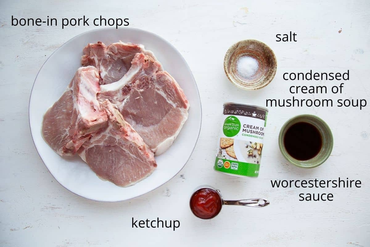 ingredients for crockpot pork chops on a white table.