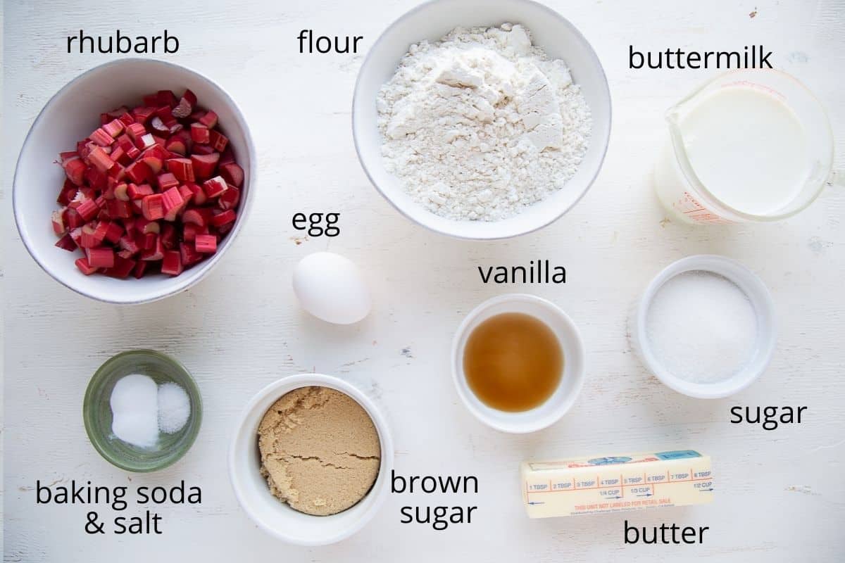 ingredients for rhubarb cake on a white table.