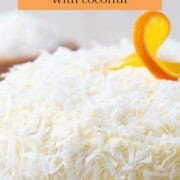 whole cake with coconut all over the top and sides.
