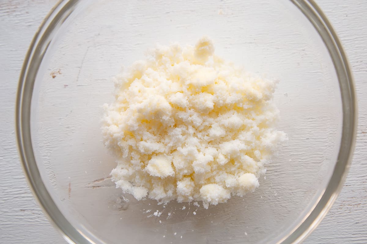 butter and sugar in a glass mixing bowl.