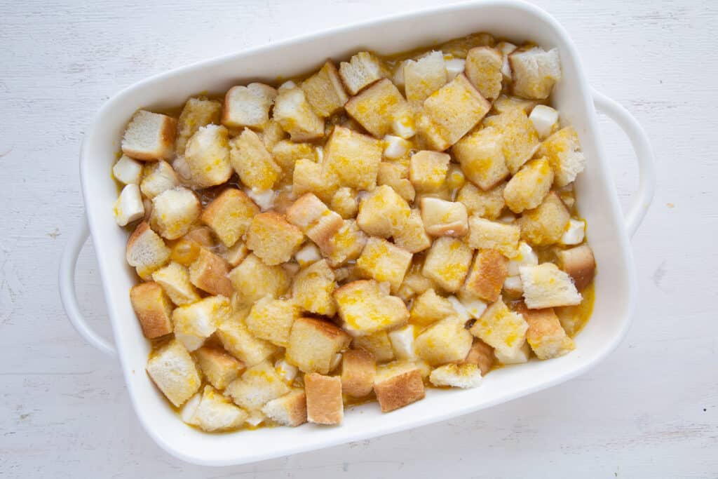 unbaked french toast casserole in a white pan.