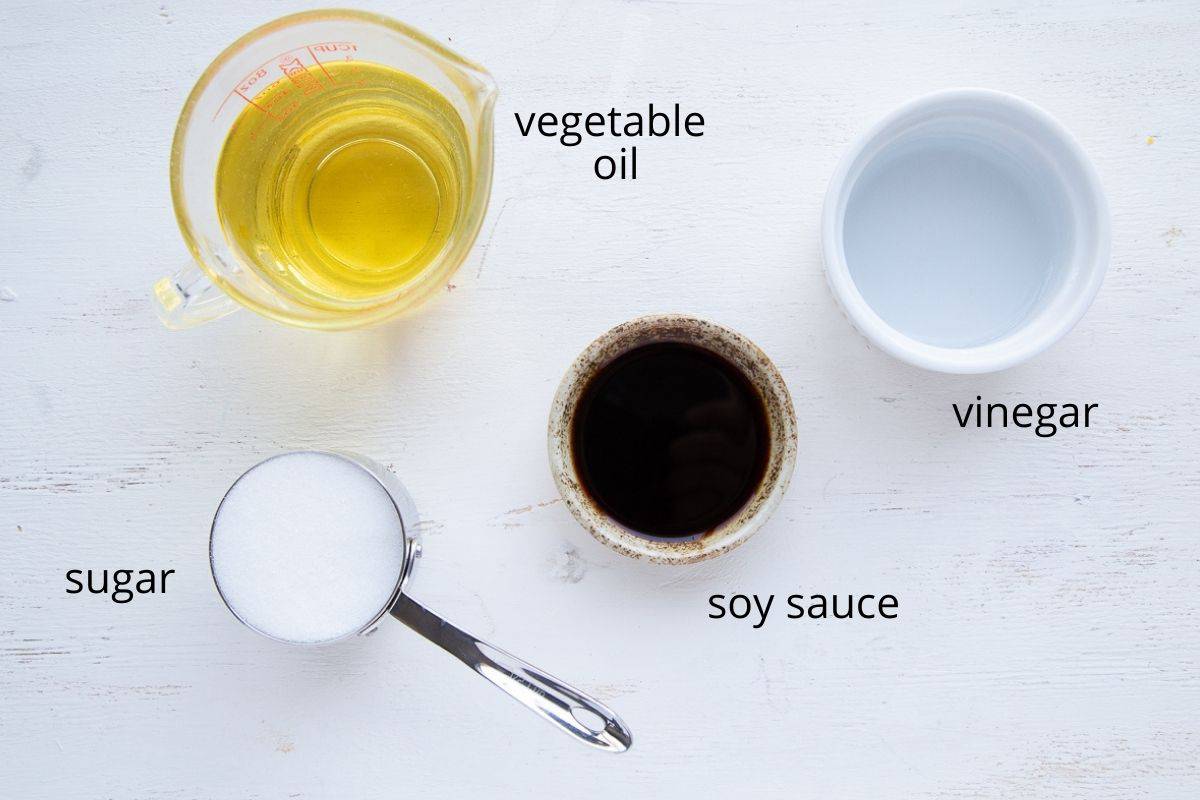 asian dressing ingredients on a white table.