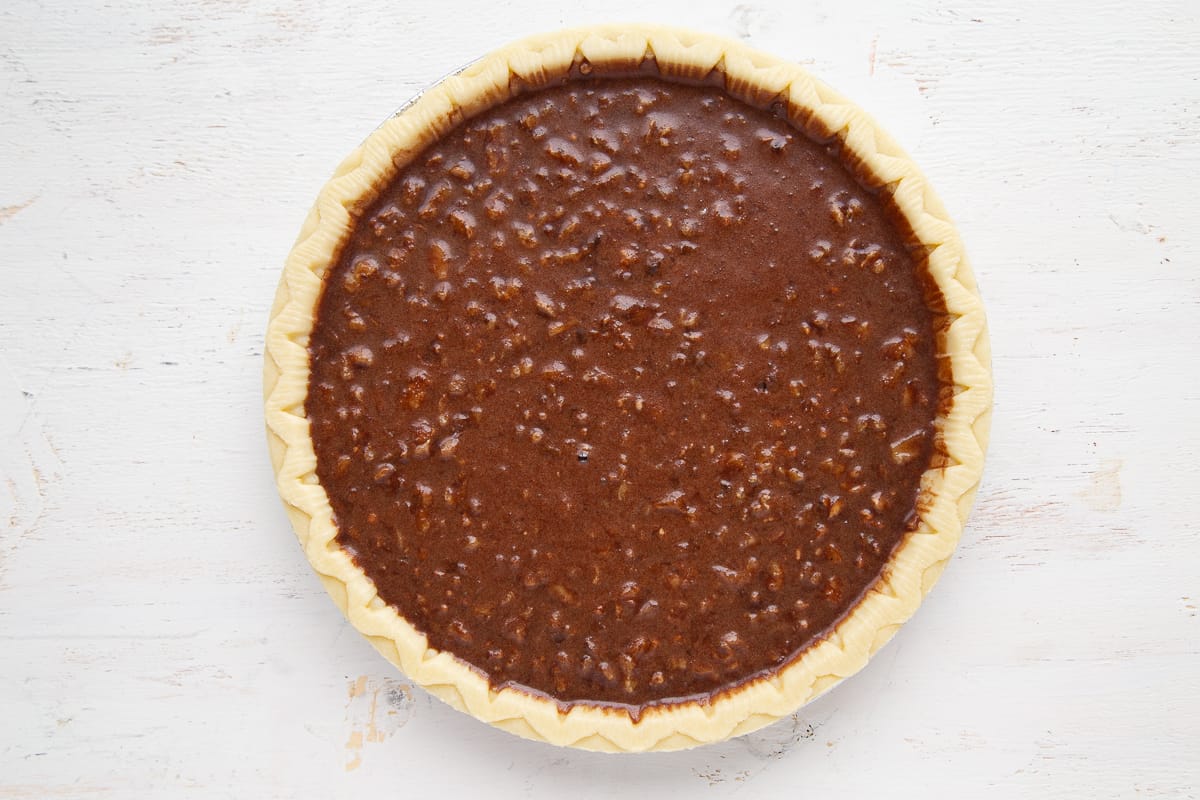 brownie batter in an unbaked pie shell.