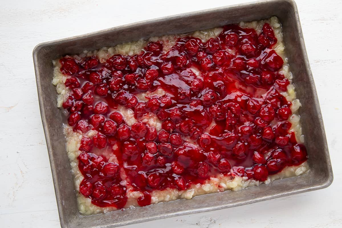 cherry pie filling and pineapple in a 13x9 inch pan.